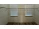 Empty walk-in closet has wire shelving, a window and plank flooring at 135 Sunset Rd, Rotonda West, FL 33947
