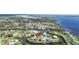 An aerial view shows a canal-front home with a large backyard at 505 Sally Lee Dr, Ellenton, FL 34222