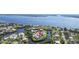 An aerial view of a waterfront home surrounded by tropical landscaping at 505 Sally Lee Dr, Ellenton, FL 34222