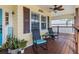 Front porch with rocking chairs and potted plants at 505 Sally Lee Dr, Ellenton, FL 34222