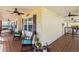Spacious front porch with rocking chairs, ceiling fans and access to backyard at 505 Sally Lee Dr, Ellenton, FL 34222