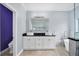 Bathroom featuring a double vanity and a modern soaking tub at 8115 61St N St, Pinellas Park, FL 33781