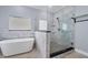 Bathroom with a freestanding tub and a large walk-in shower at 8115 61St N St, Pinellas Park, FL 33781