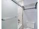 Updated bathroom with marble shower, frosted glass door, and a toilet at 8115 61St N St, Pinellas Park, FL 33781