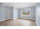 Spacious bedroom with a window and wood-like floor at 8115 61St N St, Pinellas Park, FL 33781