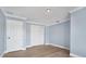 Simple bedroom with light walls, wood flooring, and double door closet at 8115 61St N St, Pinellas Park, FL 33781