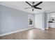 Well-lit bedroom featuring wood-look floors and a double door closet at 8115 61St N St, Pinellas Park, FL 33781