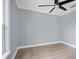 Simple bedroom with light gray walls and wood-look floors at 8115 61St N St, Pinellas Park, FL 33781