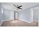 Bright bedroom with light walls, wood flooring, and a closet at 8115 61St N St, Pinellas Park, FL 33781