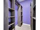 Walk-in closet with gray wood shelving and hanging rod at 8115 61St N St, Pinellas Park, FL 33781