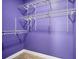 Purple-walled closet with wire shelving and hanging rods at 8115 61St N St, Pinellas Park, FL 33781