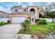Two-story house with a white garage door and landscaping at 8115 61St N St, Pinellas Park, FL 33781