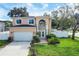 Two-story house with attached garage and manicured lawn at 8115 61St N St, Pinellas Park, FL 33781