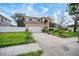 Two-story house with attached garage and well-maintained lawn at 8115 61St N St, Pinellas Park, FL 33781
