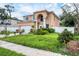 Two-story house with a white garage door and landscaping at 8115 61St N St, Pinellas Park, FL 33781