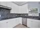 Modern kitchen with white cabinets and stainless steel appliances at 8115 61St N St, Pinellas Park, FL 33781