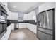 Modern kitchen with white cabinets and stainless steel appliances at 8115 61St N St, Pinellas Park, FL 33781