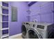 Bright laundry room, features washer, dryer, shelving, and built-in storage at 8115 61St N St, Pinellas Park, FL 33781