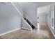 Modern staircase with metal railing leading to the second floor at 8115 61St N St, Pinellas Park, FL 33781