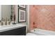 Elegant bathroom with herringbone tile and updated fixtures at 14370 Hammock Oak St, Parrish, FL 34219