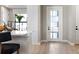 Bright entryway with modern flooring and a glass-paneled door at 14370 Hammock Oak St, Parrish, FL 34219