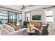 Open Gathering room features a large TV, comfortable seating, and access to outdoor patio at 14370 Hammock Oak St, Parrish, FL 34219