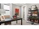 Functional home office with built-in shelving and a workspace at 14370 Hammock Oak St, Parrish, FL 34219