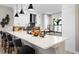 Modern kitchen featuring white cabinets, quartz countertops, and an island at 14370 Hammock Oak St, Parrish, FL 34219