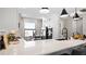 Modern kitchen with white cabinets, quartz countertops and a breakfast bar at 14370 Hammock Oak St, Parrish, FL 34219