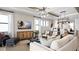 Bright living room with large windows and stylish furnishings at 14370 Hammock Oak St, Parrish, FL 34219