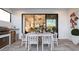 Relaxing outdoor patio with dining area and built-in grill at 14370 Hammock Oak St, Parrish, FL 34219