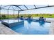 Resort-style pool with spa and water features; screened enclosure at 14370 Hammock Oak St, Parrish, FL 34219
