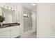 Clean bathroom with tub shower, vanity, and mirror at 15392 Taurus Cir, Port Charlotte, FL 33981