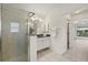 Bathroom with a large walk-in shower and vanity at 15392 Taurus Cir, Port Charlotte, FL 33981