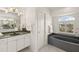 Bathroom featuring a large soaking tub and separate shower at 15392 Taurus Cir, Port Charlotte, FL 33981