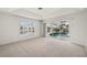 Primary bedroom with sliding doors to the pool area at 15392 Taurus Cir, Port Charlotte, FL 33981