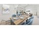 Dining room with a wooden table and access to living room at 15392 Taurus Cir, Port Charlotte, FL 33981