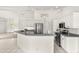 Bright kitchen with stainless steel appliances and an island at 15392 Taurus Cir, Port Charlotte, FL 33981