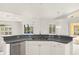 Kitchen with a breakfast bar overlooking the pool at 15392 Taurus Cir, Port Charlotte, FL 33981