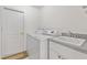 Laundry room with washer, dryer, and utility sink at 15392 Taurus Cir, Port Charlotte, FL 33981