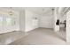 Open living room with a view of the kitchen and foyer at 15392 Taurus Cir, Port Charlotte, FL 33981