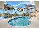 Relaxing kidney-shaped pool with screened enclosure at 15392 Taurus Cir, Port Charlotte, FL 33981