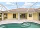Relaxing pool and patio area with seating at 15392 Taurus Cir, Port Charlotte, FL 33981