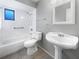 Clean bathroom with a pedestal sink, toilet and bathtub at 2092 Nuremberg Blvd, Punta Gorda, FL 33983
