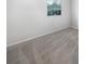 Simple bedroom with grey carpet and a window with blinds at 2092 Nuremberg Blvd, Punta Gorda, FL 33983