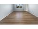 Well-lit bedroom with light walls and wood-look flooring at 2092 Nuremberg Blvd, Punta Gorda, FL 33983