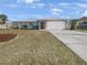 Single-story home with a well-maintained lawn and attached garage at 2092 Nuremberg Blvd, Punta Gorda, FL 33983