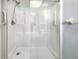 Clean shower with glass enclosure and shelving at 2092 Nuremberg Blvd, Punta Gorda, FL 33983
