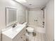 Clean bathroom with a bathtub, toilet, and vanity with a mirror at 2587 Forest Run Ct # 141B, Clearwater, FL 33761