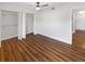 Bedroom with wood-look floors and double closets at 2587 Forest Run Ct # 141B, Clearwater, FL 33761